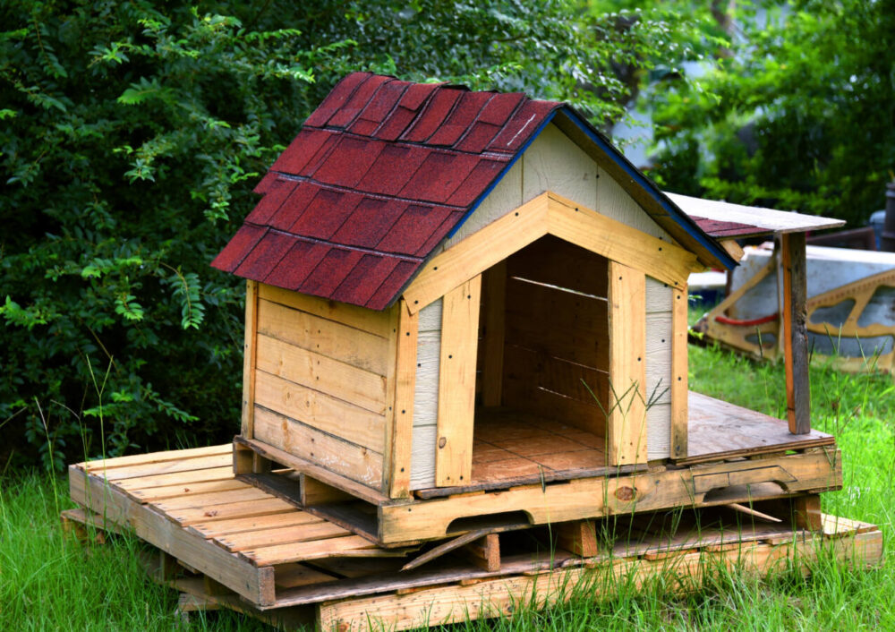 pallet wood dog house with shingle roof