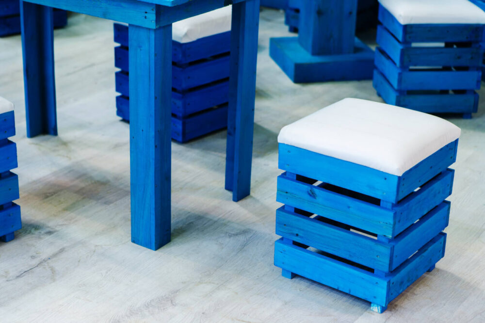 blue painted pallet stool with white cushion