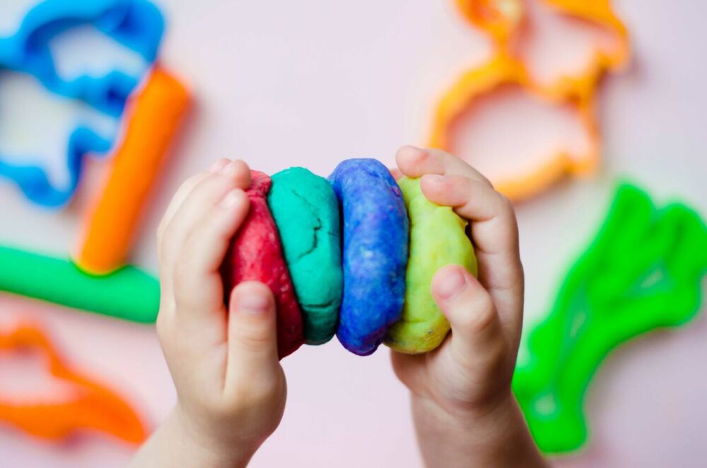 Child’s hands holding homemade play dough