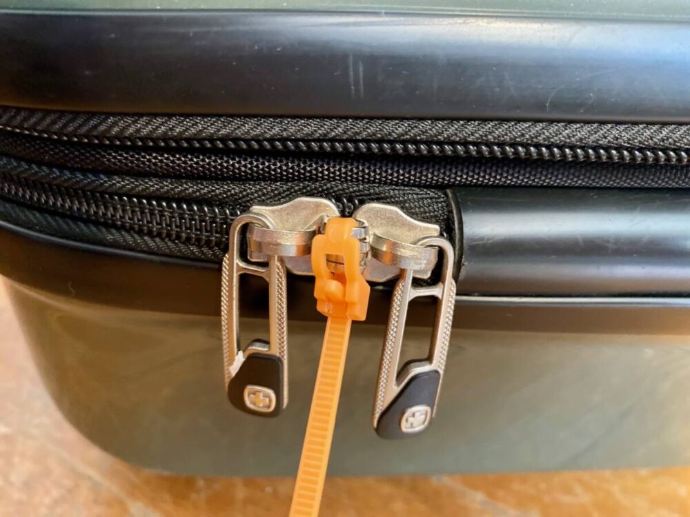 zip tie locks luggage zippers together