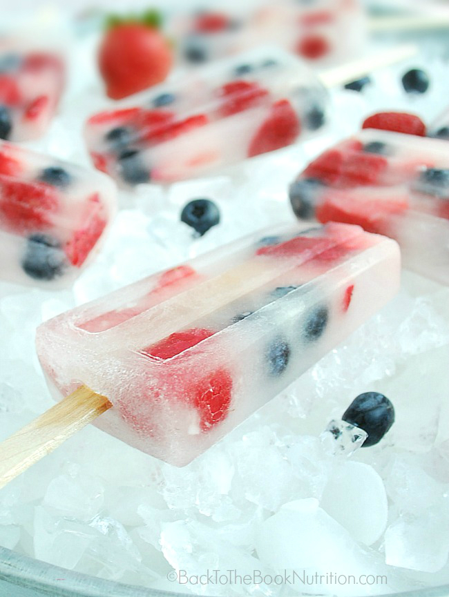 Healthy-and-refreshing-red-white-and-blue-popsicles-made-from-just-coconut-water-and-fresh-berries-perfect-for-the-4th-of-July