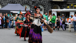 People dressed as witches on parade at Halloweentown festival