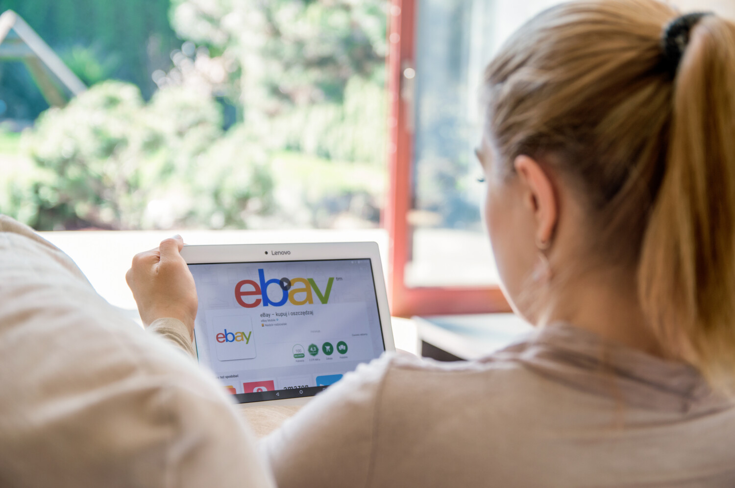 Woman looks at eBay on tablet