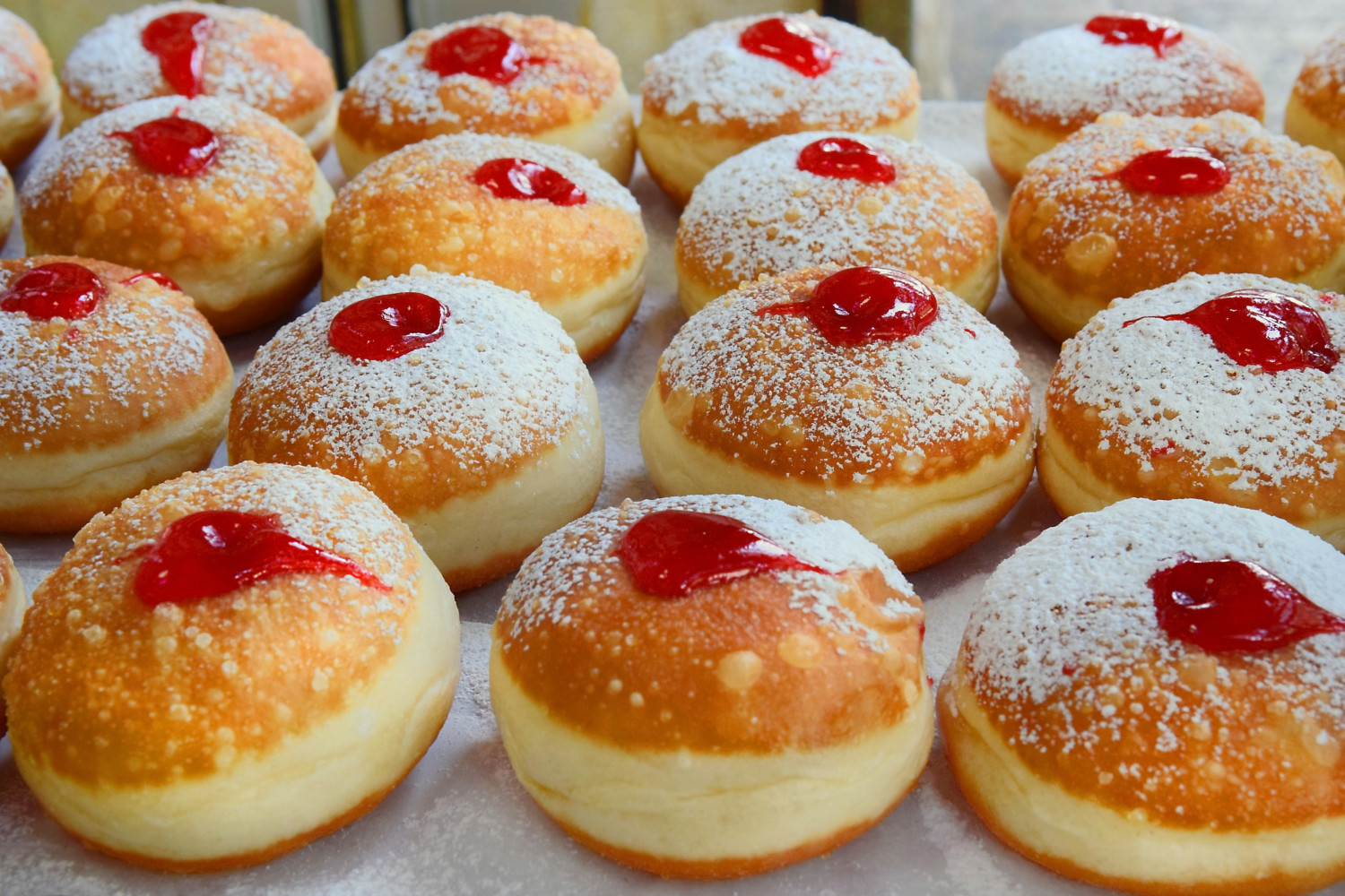 traditional hanukkah sufganiyot donuts with strawberry jelly