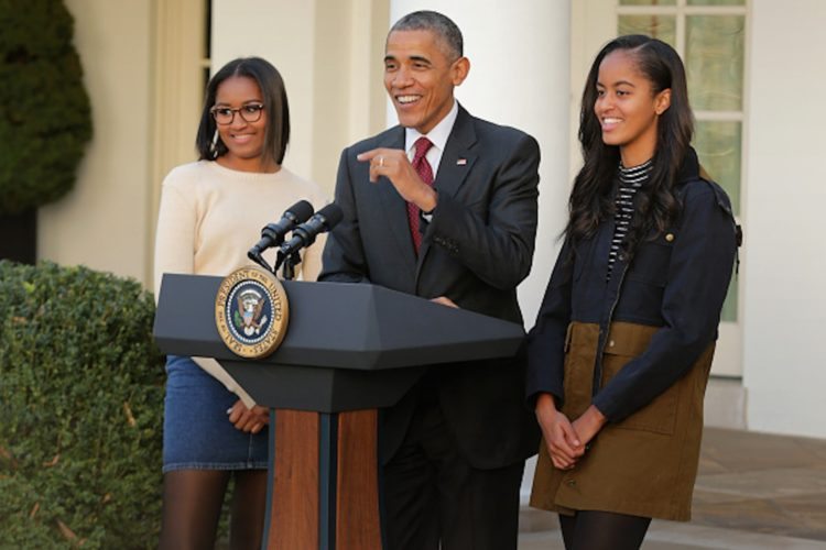 WASHINGTON, DC - NOVEMBER 25: U.S. President Barack Obama delivers remarks with his daughters Sasha (L) and Malia during the annual turkey pardoning ceremony in the Rose Garden at the White House November 25, 2015 in Washington, DC. In a tradition dating back to 1947, the president pardons a turkey, sparing the tom -- and his alternate -- from becoming a Thanksgiving Day feast. This year, Americans were asked to choose which of two turkeys would be pardoned and to cast their votes on Twitter. (Photo by Chip Somodevilla/Getty Images)