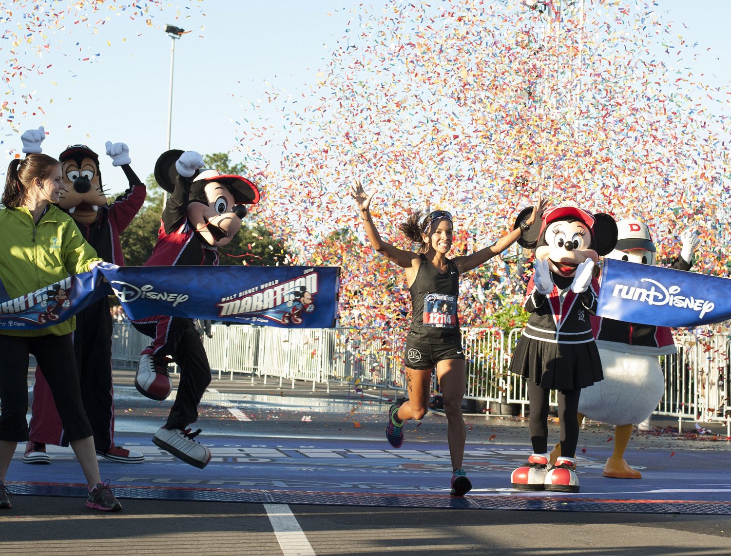 LAKE BUENA VISTA, FL - JANUARY 12: In this handout photo provided by Disney Parks, Angela Brito of Guayaquil, Ecuador crosses the finish line with an official time of 2:47:44 at the 2014 Walt Disney World Marathon presented by runDisney on January 12, 2014 in Lake Buena Vista, Florida. The 26.2 mile race goes through all four Walt Disney World theme parks capping off running events throughout the weekend. (Photo by Preston Mack/Disney Parks via Getty Images)