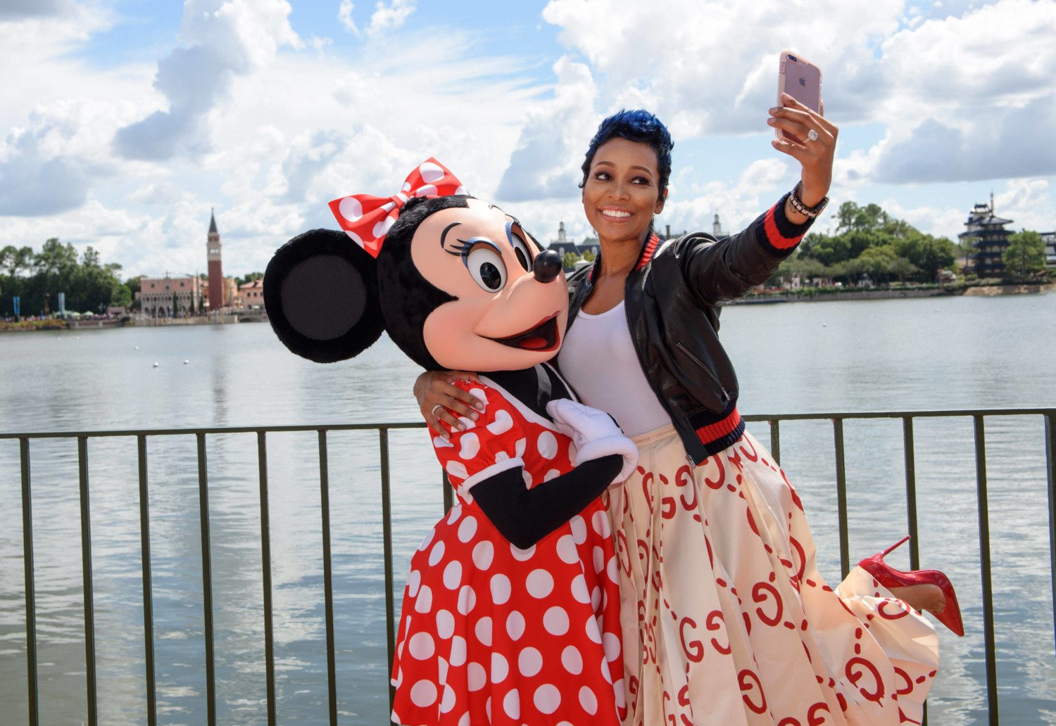 LAKE BUENA VISTA, FL - OCTOBER 06: In this handout photo provided by Disney Parks, Grammy award-winning R&B artist Monica poses with Minnie Mouse on while on break from taping ABC's Emmy-award winning show, "The Chew," at Epcot at Walt Disney World Resort October 6, 2016 in Lake Buena Vista, Florida. "The Chew" taped five shows from the 21st Epcot International Food & Wine Festival with co-hosts Mario Batali, Michael Symon, Carla Hall, Clinton Kelly and Daphne Oz. Episodes featuring different celebrity guests will air on the ABC Television Network, October 10-14, at 1 p.m. EDT, 12 p.m. PDT (check local listings). (Photo by Todd Anderson/Disney Parks via Getty Images)