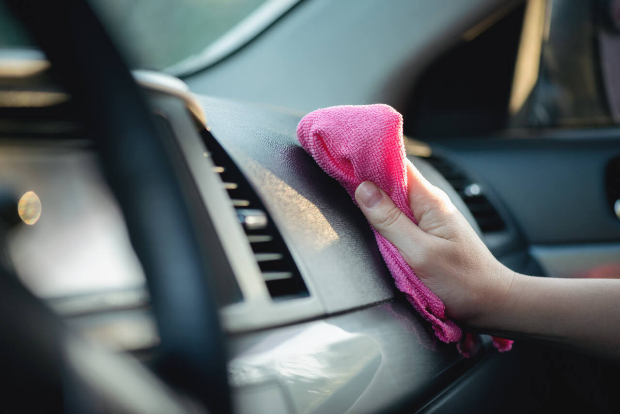 cleaning rag polishing car dashboard