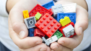 Lego bricks in child's hands