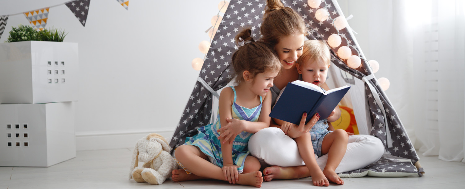 Mom reads to two young girls