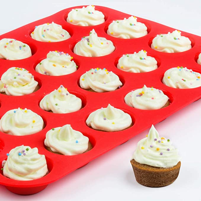 Silicone mini muffin pan in red with cupcakes