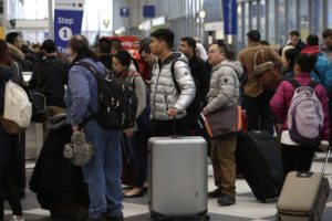 Travelers Fight Crowds On Busiest Travel Day Of Holiday Season