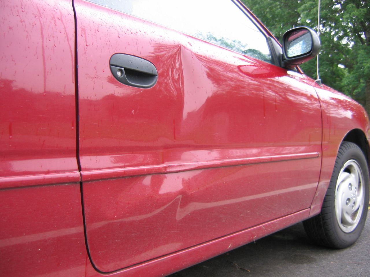Video reveals one clever way to fix a dent in your car