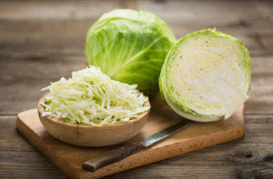 Head of cabbage sliced and shredded