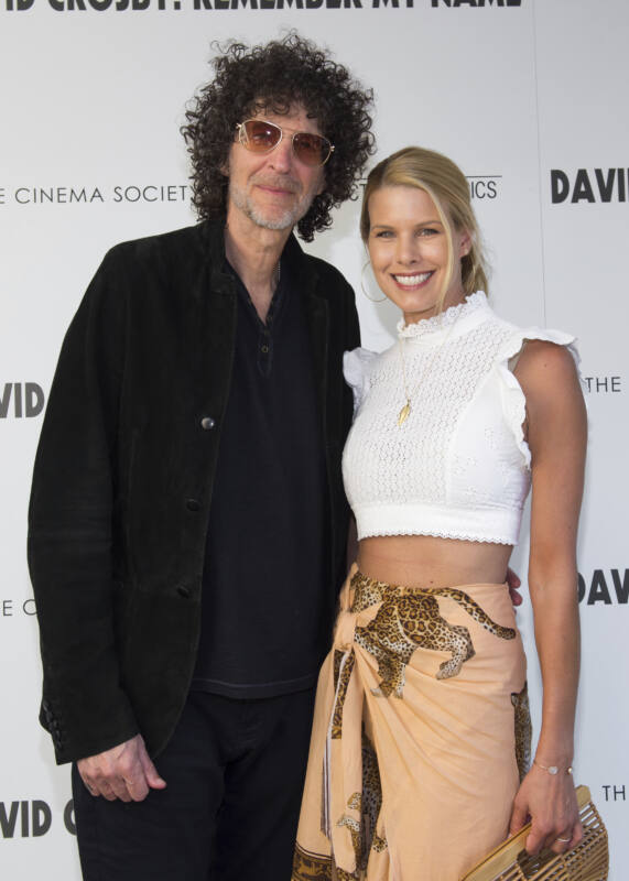Howard Stern and Beth Ostrosky pose on red carpet