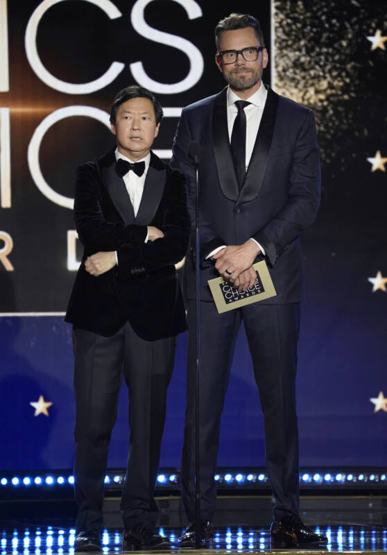 Ken Jeong and Joel McHale stand onstage at awards show
