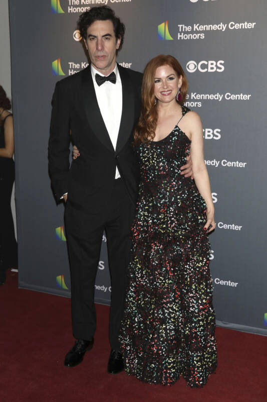 Sacha Baron Cohen and Isla Fisher pose on red carpet