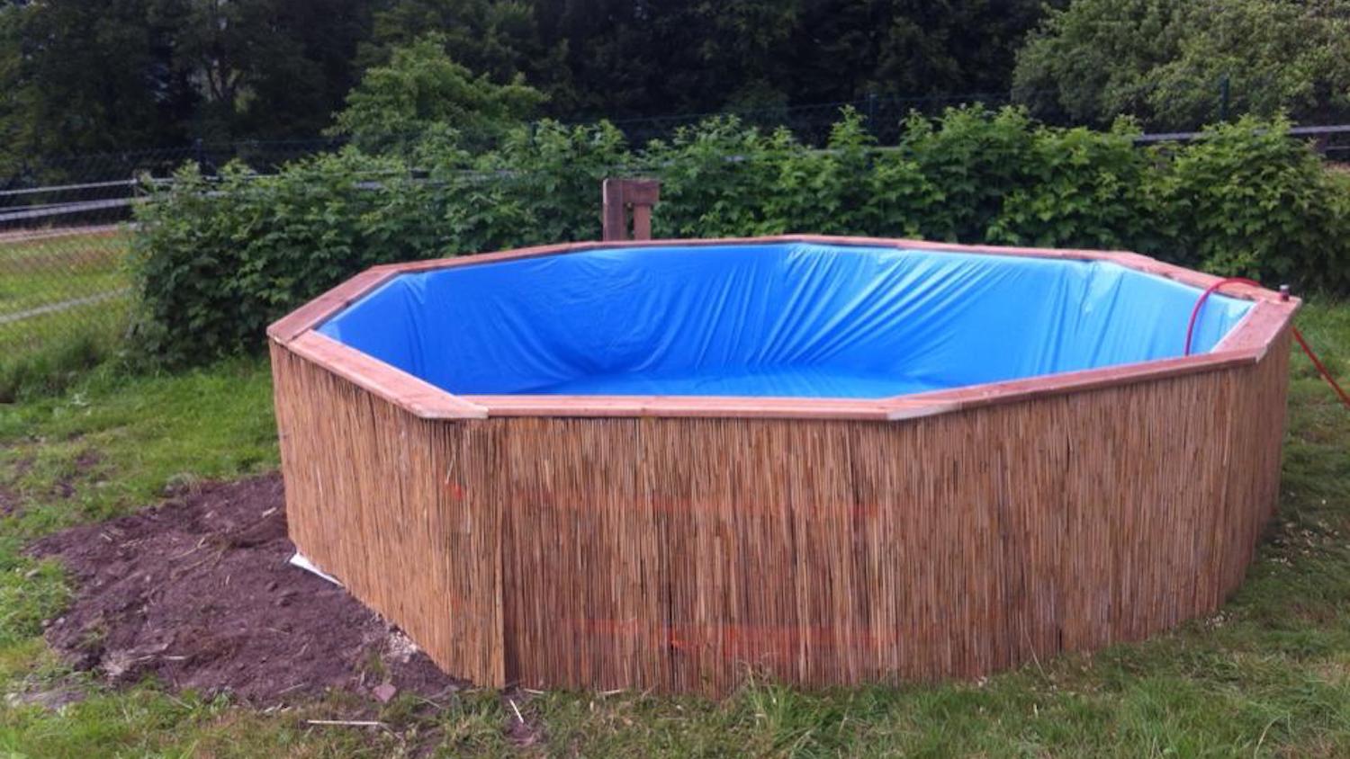 Backyard swimming pool made of pallets