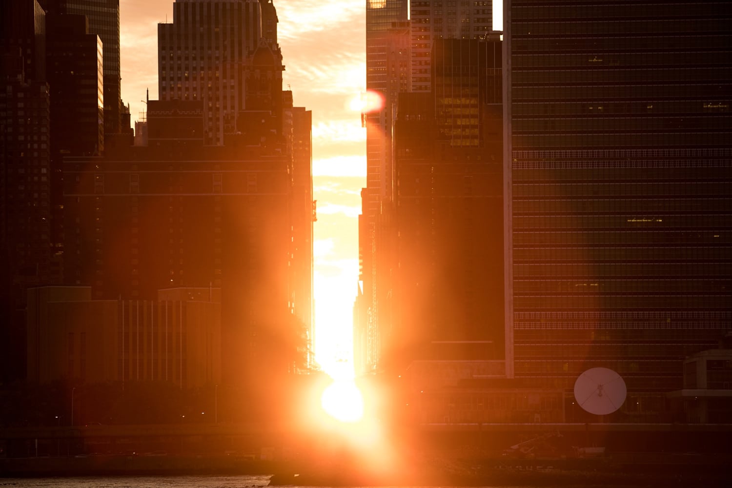 Sunset Alights Perfectly Between NYC Buildings During Manhattanhenge