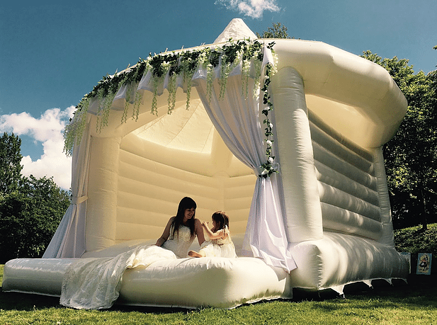 Brides and grooms are now renting bouncy castles for their weddings