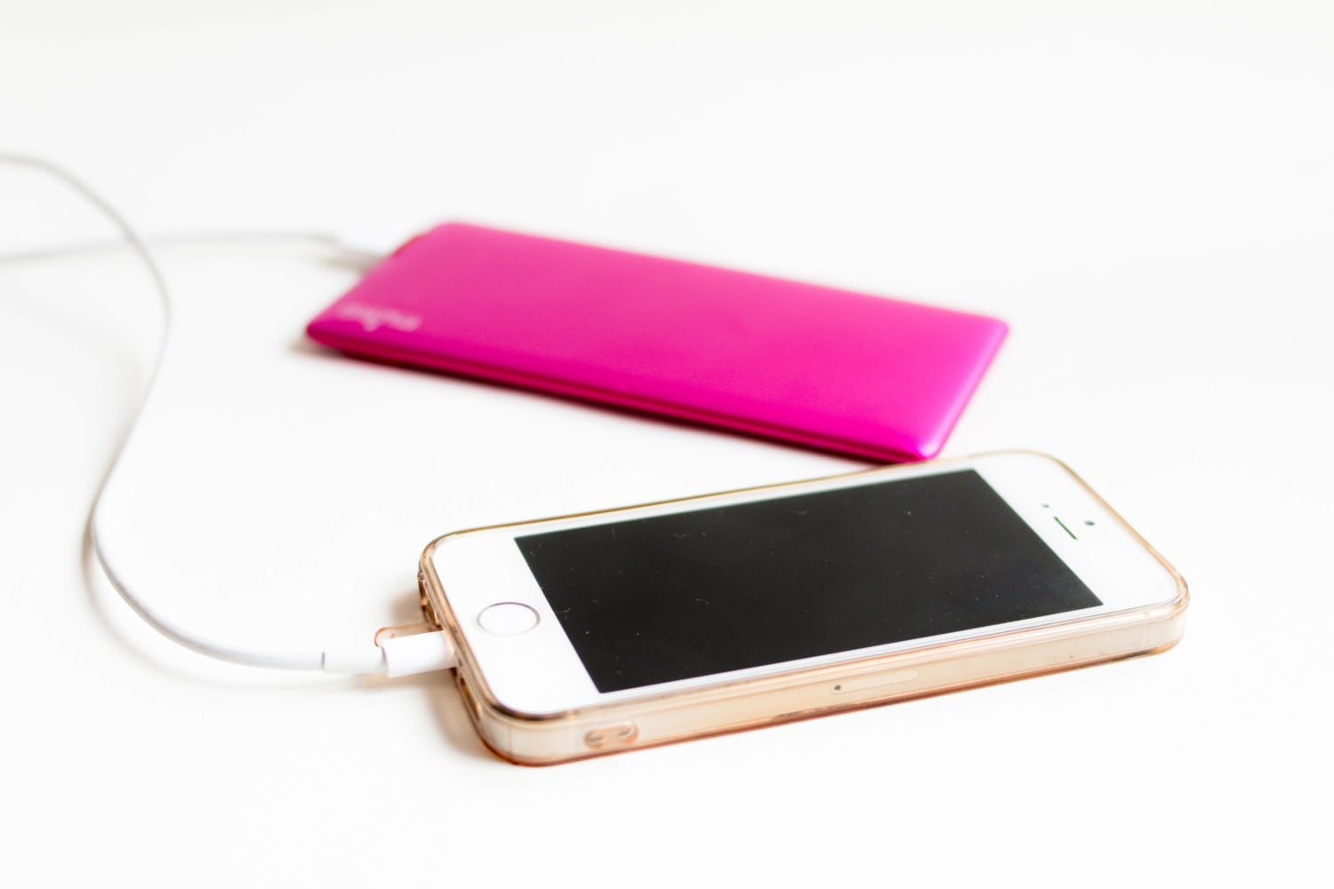 iPhone 5c with pink charger