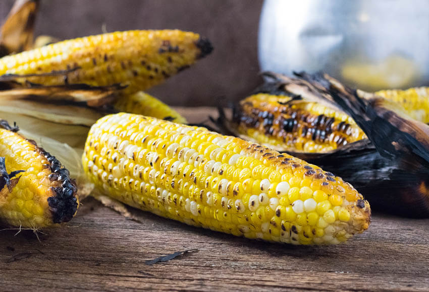 Grilled corn on wooden table