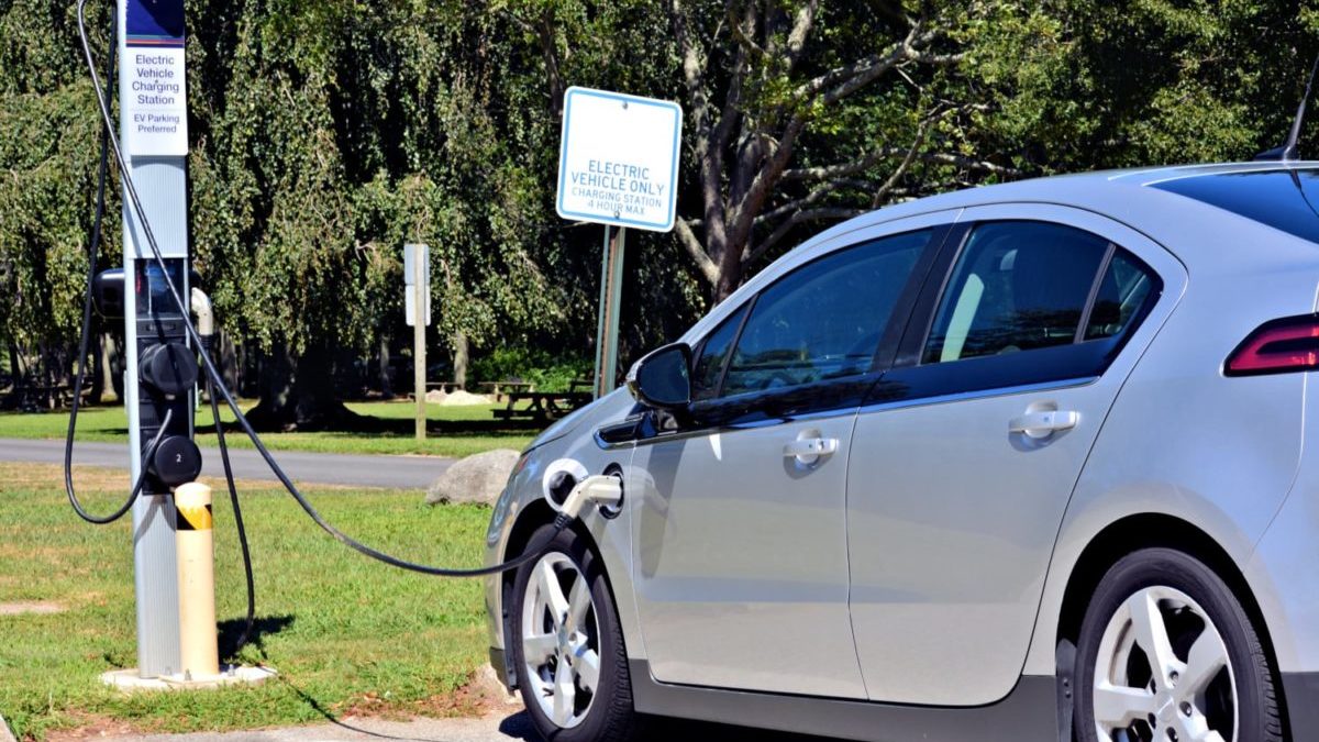 An electric car recharges at a public charging station.