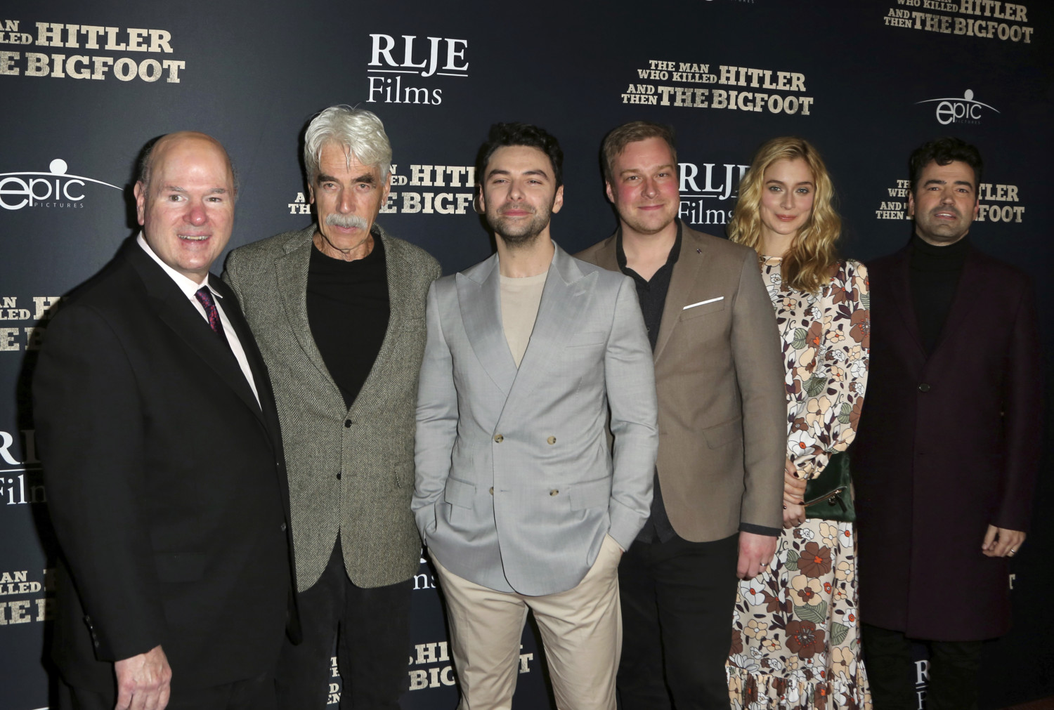 Larry Miller, from left, Sam Elliott, Aidan Turner, Robert D. Krzykowski, Caitlin FitzGerald and Ron Livingston arrive at the LA Premiere of "The Man Who Killed Hitler and Then The Bigfoot" at the ArcLight Hollywood on Monday, Feb. 4, 2019, in Los Angeles. (Photo by Willy Sanjuan/Invision/AP)