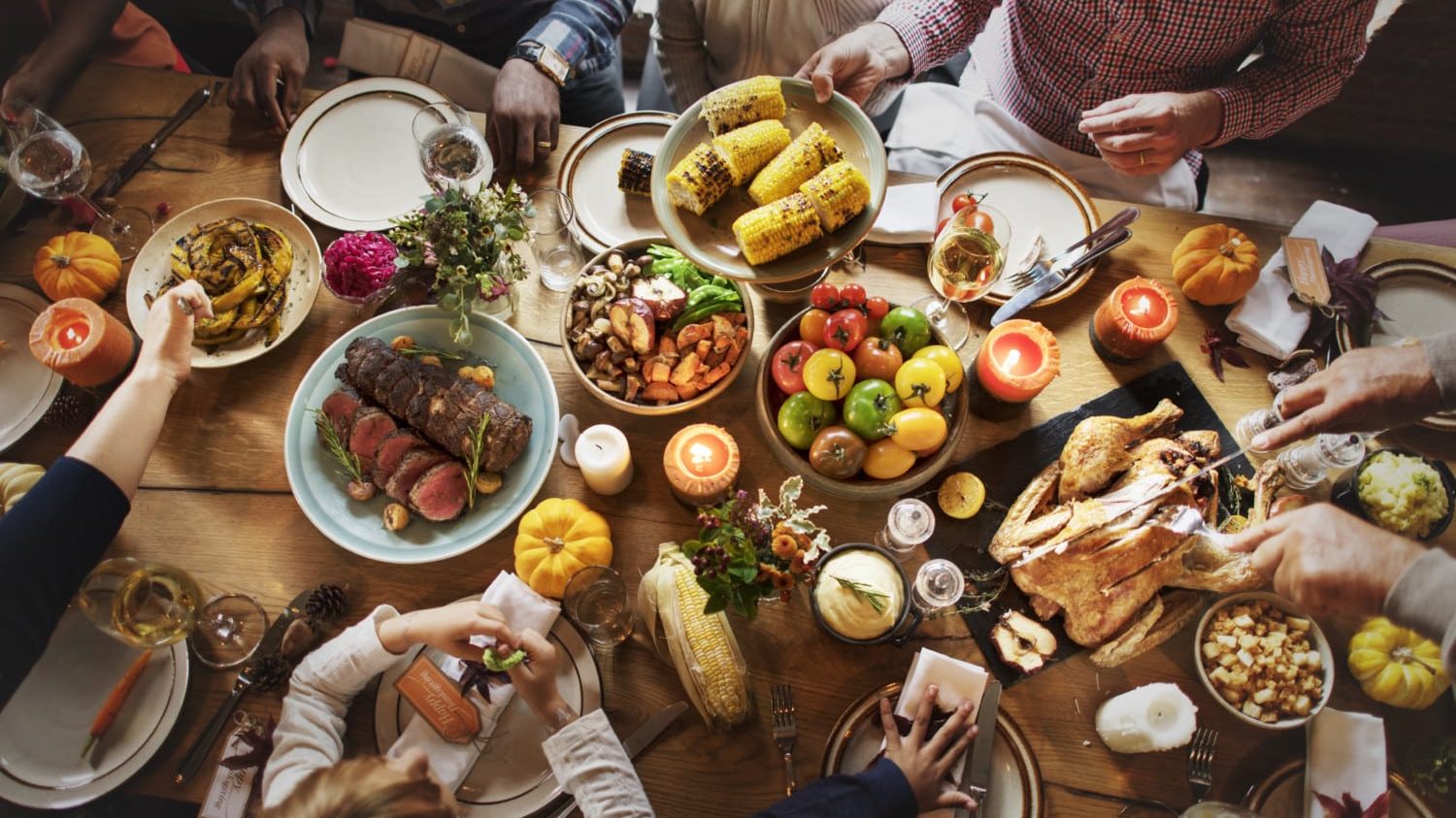 People gather around Thanksgiving table