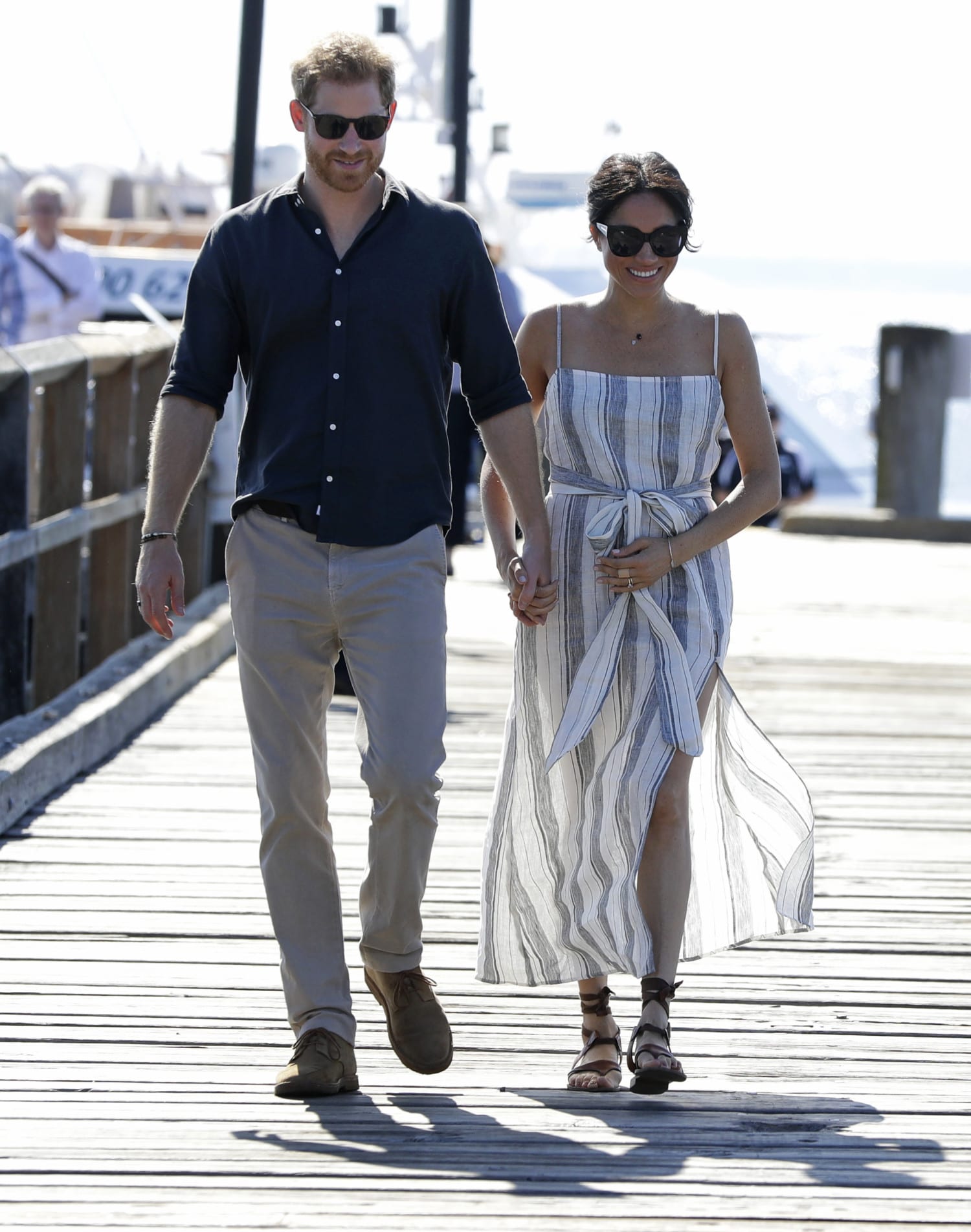 Harry and Meghan walking on dock