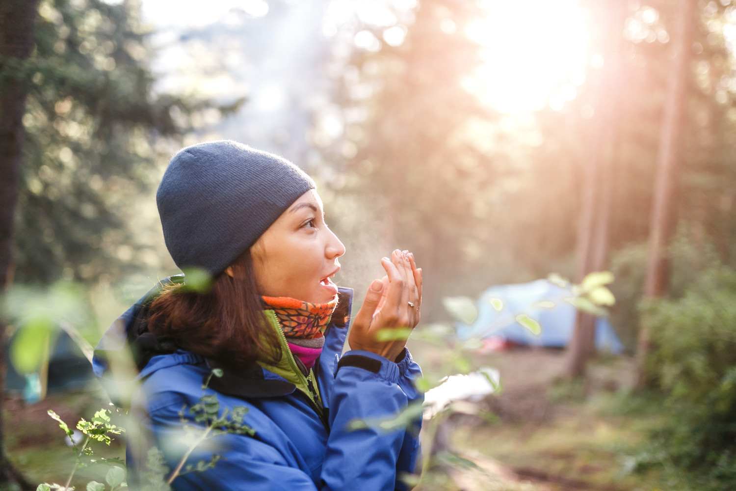 Active woman in cold weather in mountain camping