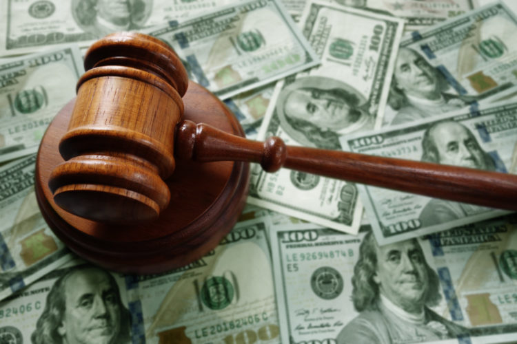 Judges legal gavel on assorted cash