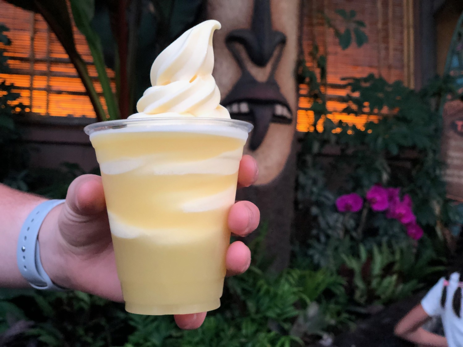 Hand holds Dole Whip in a cup