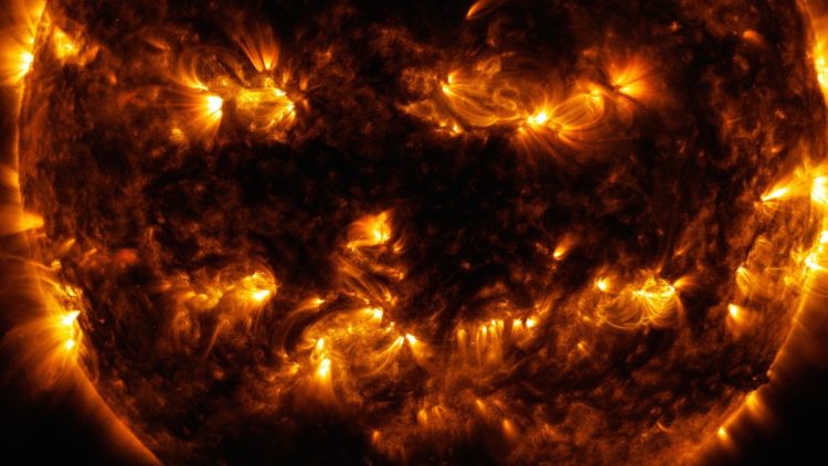 Close up of ho sun image that looks like jack-0-lantern