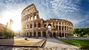 Colosseum in Rome and morning sun, Italy