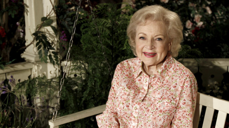 Betty White sits on bench