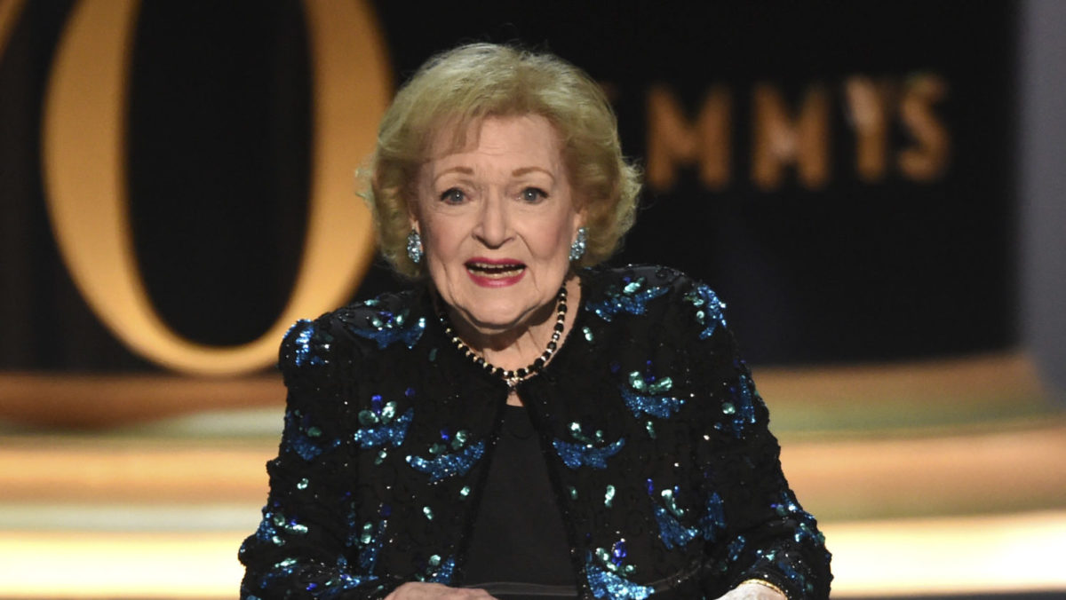 Betty White stands on stage at the Emmys in 2018.