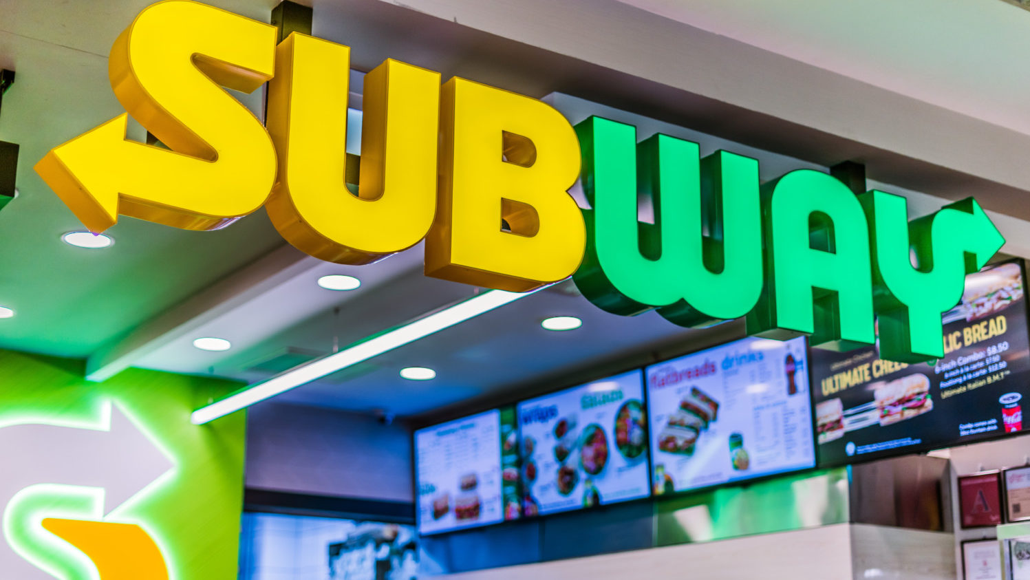 Subway sandwich sign at entrance to restaurant
