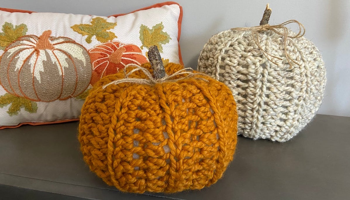 Crochet pumpkins in orange, oat colored yarn
