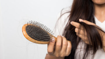 woman with brush hair loss