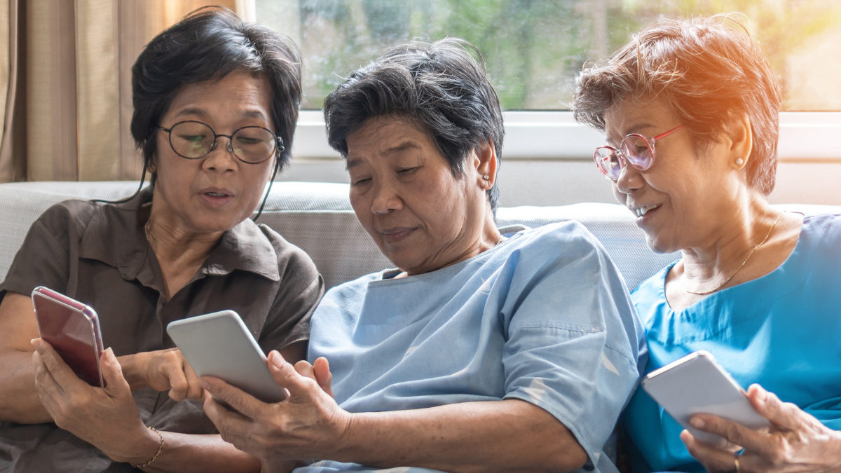 Elder women play game on smartphone