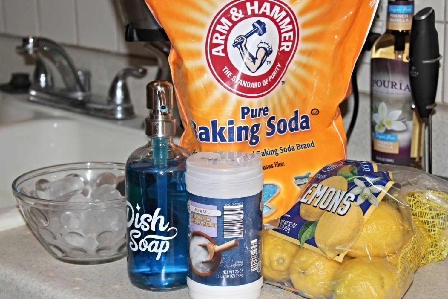 Baking soda, soap, lemons, ice for cleaning garbage disposal