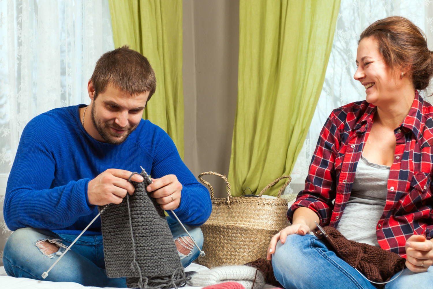 couple knitting laughing