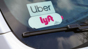Car with Uber and Lyft stickers