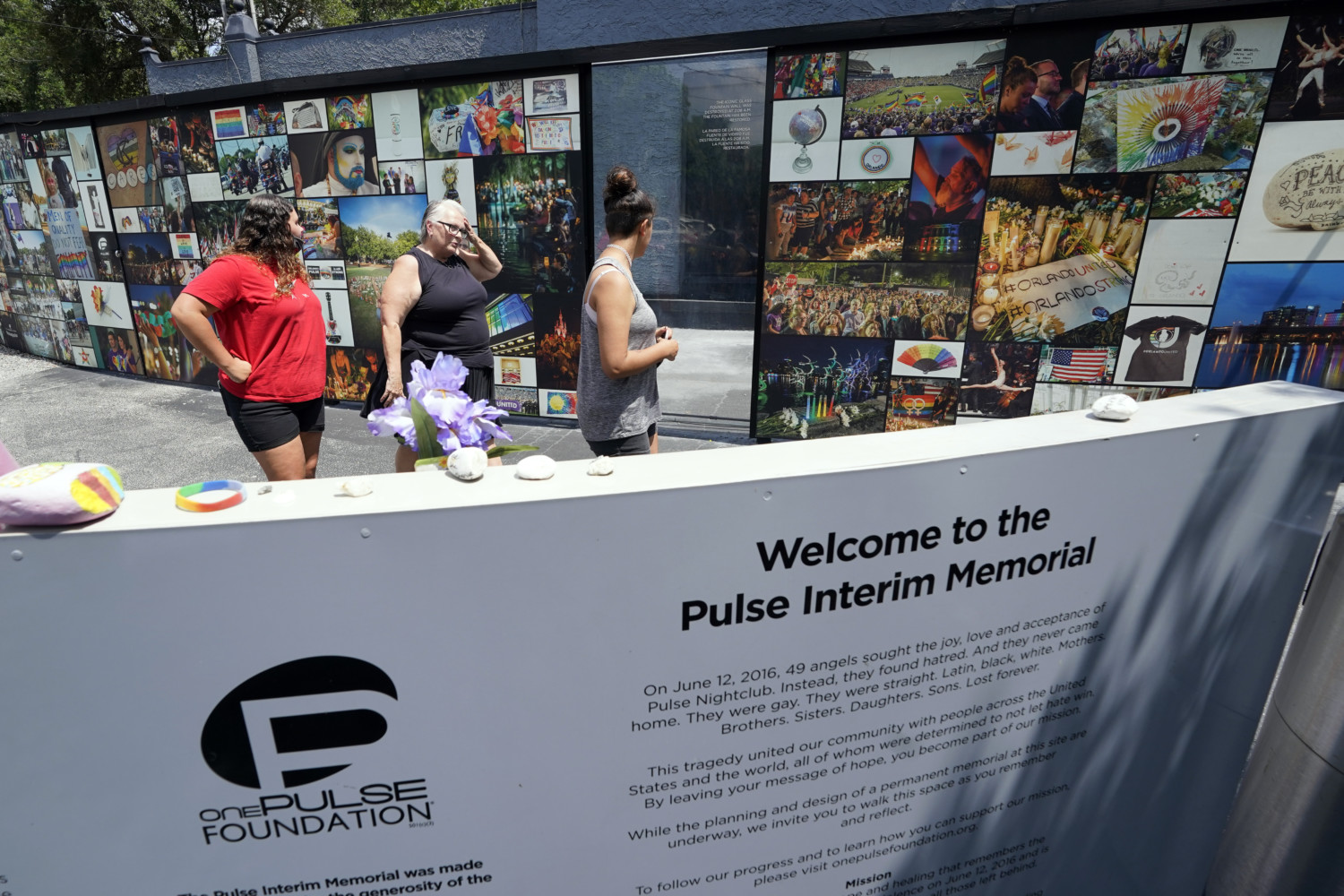 Visitors at Pulse Nightclub's interim memorial in Orlando