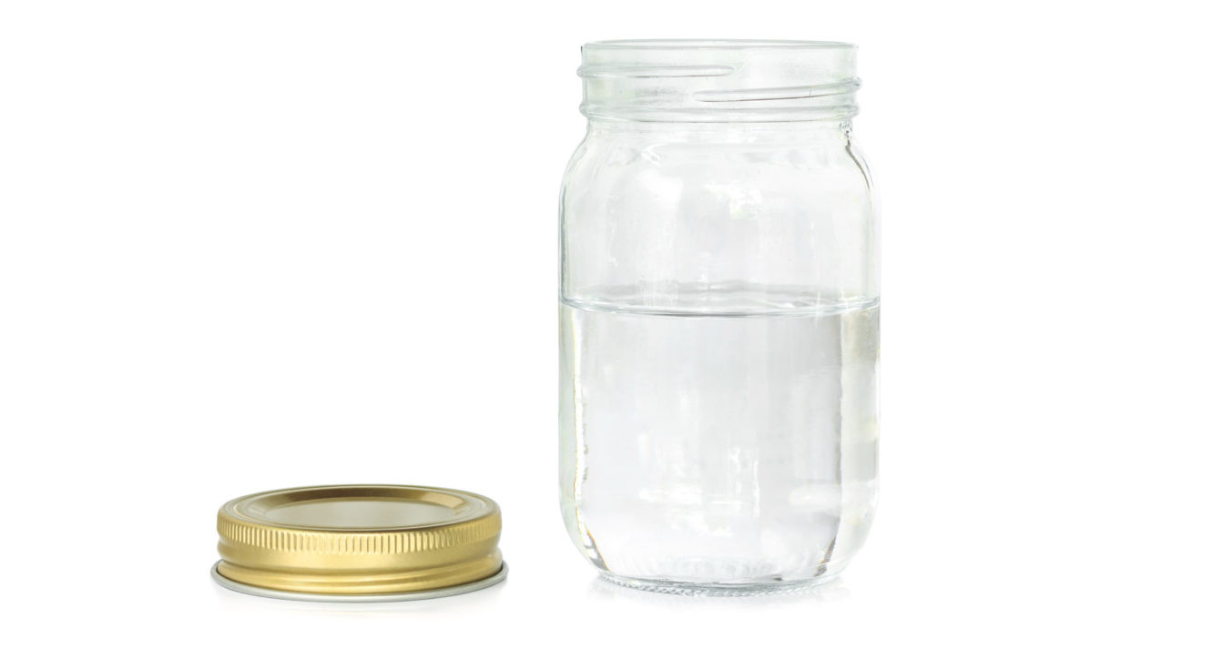Water in a mason jar with lid off