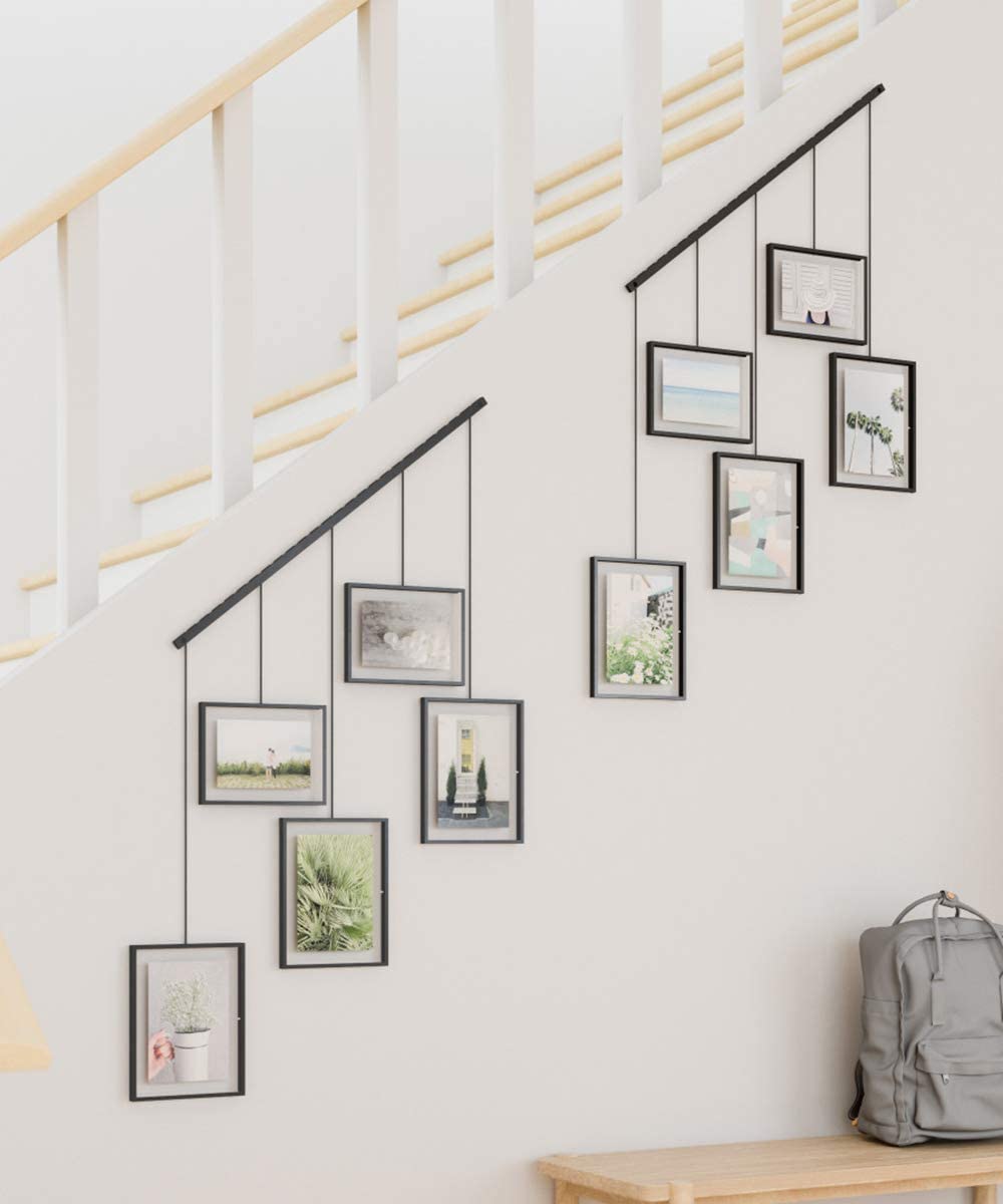 Pictures displayed using a picture hanging system