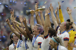 Megan Rapinoe of US Women's soccer team holds trophy after winning World Cup