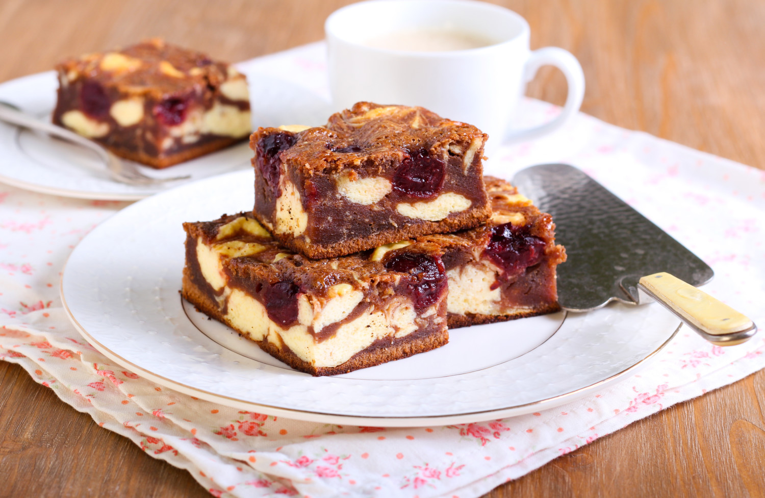 Cherry cheesecake marbled brownies bars on plate