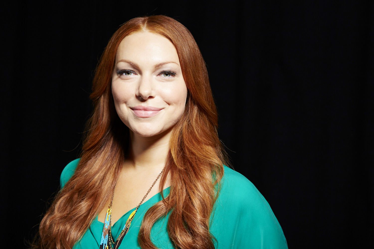 Laura Prepon smiles with red hair in 2013